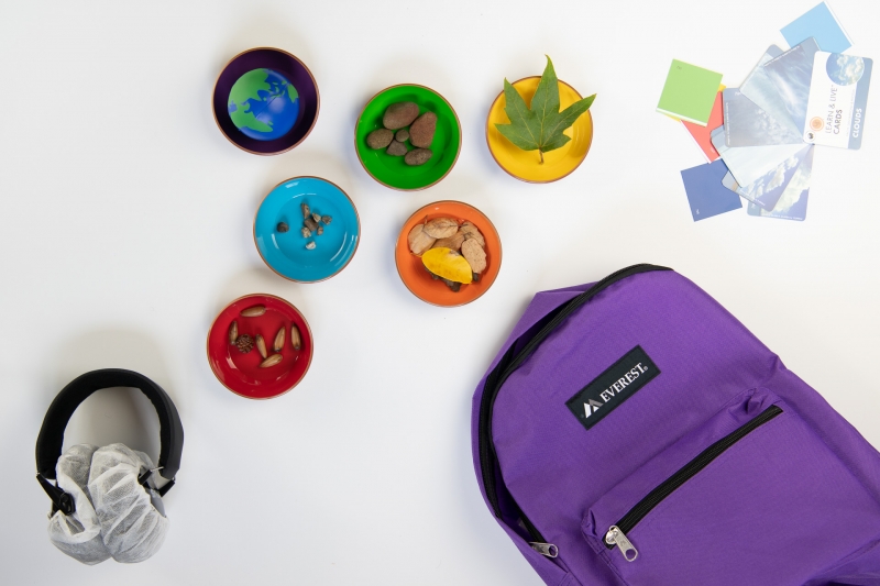 A purple backpack with goodies to ground yourself in your senses on your visit