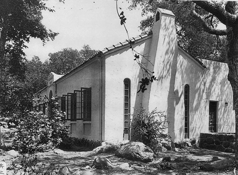 An old black-and-white photo of one of the Museum's first buildings. You can recognize it as the entrance building, with heavy white stucco walls and a tile roof.