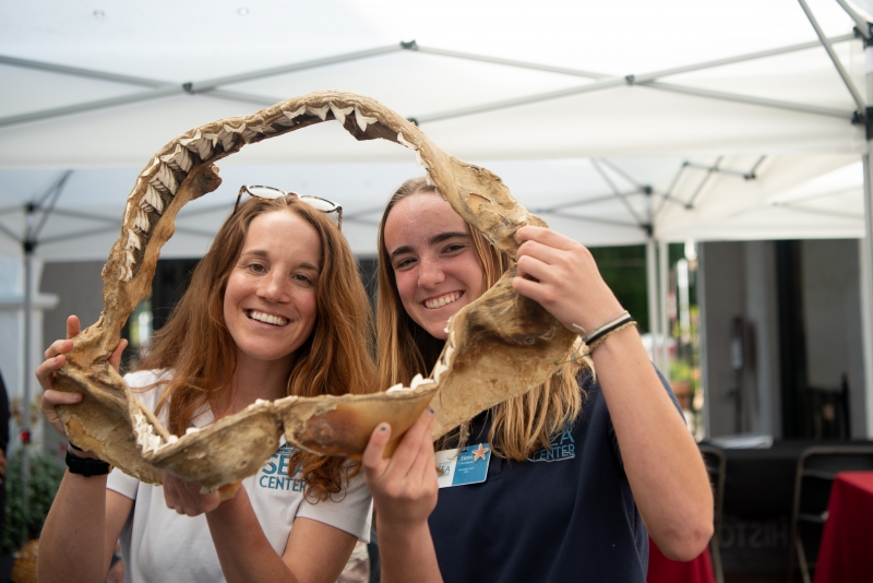 Sea Center Volunteers holding Shark jaw bone