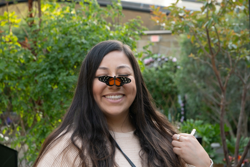 Butterflies Alive! visitor with a butterfly on her nose
