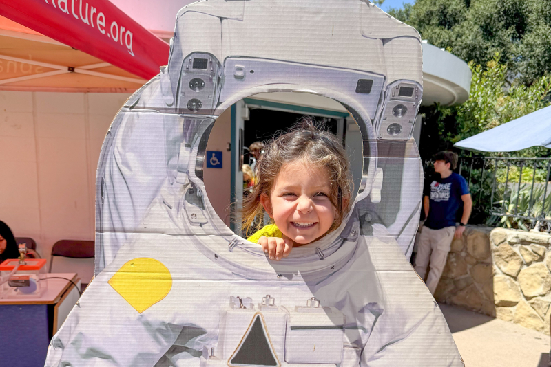 Nature Adventures camper in astronaut cutout