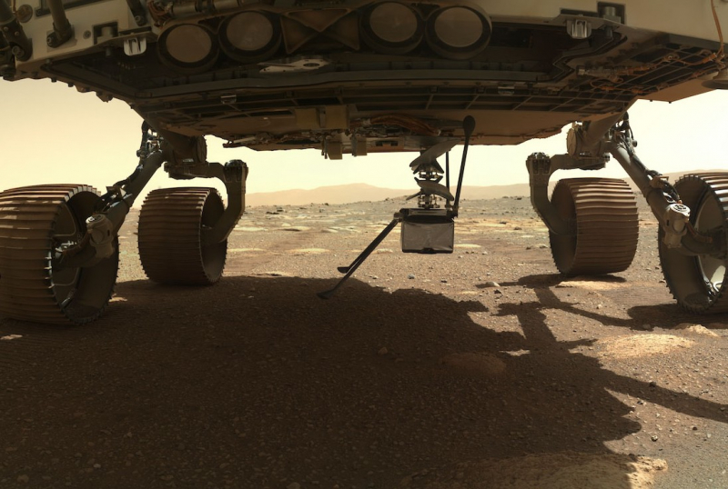 An image from the surface of Mars showing a small craft emerging underneath a large one
